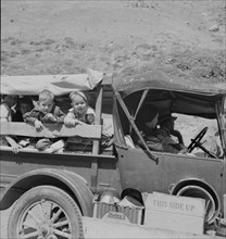 Family of drought refugees on US 99 near Bakersfield, California, 1937. Creator: Dorothea Lange.