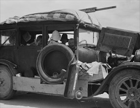 Migrant drought refugee family stalled on an Arizona highway, between Yuma and Phoenix, 1937. Creator: Dorothea Lange.