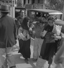 El Paso housewives after a day's shopping in Juarez, Mexico, Texas, 1937. Creator: Dorothea Lange.