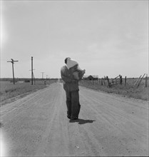 Man going home with relief, near Oil City, Carter County, Oklahoma, 1937. Creator: Dorothea Lange.