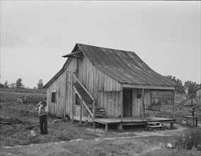 Cottonworker's cabin with outside stairway and loft, near Blytheville, Arkansas, 1937. Creator: Dorothea Lange.