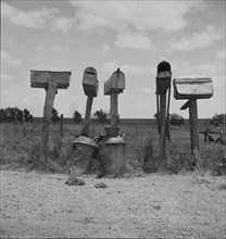 Mail boxes in Bell County, Texas, 1937. Creator: Dorothea Lange.