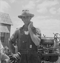 Former tenant farmer on a large cotton farm, now a tractor driver, Bell County, Texas, 1937. Creator: Dorothea Lange.