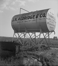 Fuel tank on the Aldridge Plantation, Mississippi, 1937. Creator: Dorothea Lange.