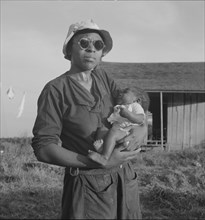 Wife and child of tractor driver, Aldridge Plantation, Mississippi, 1937. Creator: Dorothea Lange.