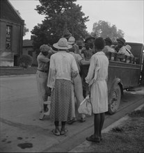 Cotton hoers leaving Greenville at 5 am for a day's work on the plantations, Mississippi, 1937. Creator: Dorothea Lange.