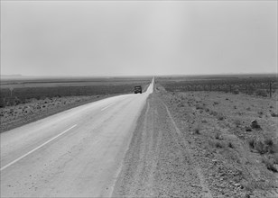 The highway going West, U.S. 80 near Lordsburg, New Mexico, 1938. Creator: Dorothea Lange.