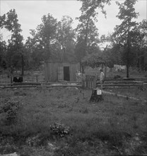 Slab house in clearing east of Atoka, Oklahoma, Atoka County, 1938. Creator: Dorothea Lange.