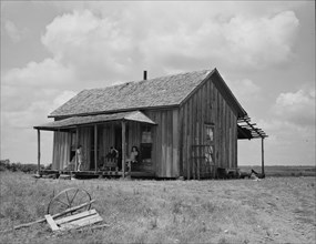 Ex-farm family, now on Works Progress Administration (WPA), US64, eastern Oklahoma, 1938. Creator: Dorothea Lange.