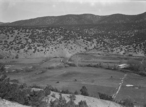 Outlying fields of Mexican village in the hills of the Tewa Basin, New Mexico, 1935. Creator: Dorothea Lange.