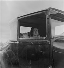 During the cotton strike, a striking picker applies for an emergency food grant, Shafter, CA, 1938. Creator: Dorothea Lange.
