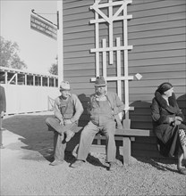 Lineup outside of Farm Security Administration grant office early in the morning, Tulare, CA, 1938. Creator: Dorothea Lange.