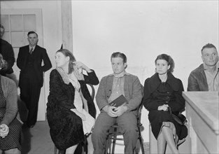 Night meeting in the Farm Security Administration office, Visalia, Tulare County, California, 1938. Creator: Dorothea Lange.