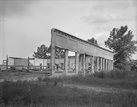 Remains of storefronts in Fullerton, Louisiana, an abandoned lumber town, 1937. Creator: Dorothea Lange.