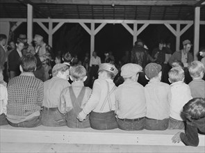 Halloween party at Shafter camp for migrants, California, 1938. Creator: Dorothea Lange.