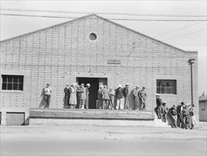 Warehouse, used as distributing office for FSA relief grants..., Bakersfield, California, 1938. Creator: Dorothea Lange.
