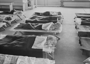 Rest time in nursery school for migrant children at Shafter Camp, California, 1939. Creator: Dorothea Lange.