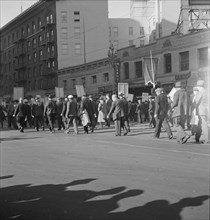 Mass meeting of WPA workers parading up Market Street, San Francisco, California , 1939. Creator: Dorothea Lange.