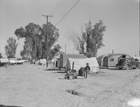 Migratory labor housing during carrot harvest, near Holtville, Imperial Valley, California , 1939. Creator: Dorothea Lange.