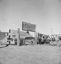 Living conditions for migratory laborers in private auto camp, Calipatria, Imperial County, 1939. Creator: Dorothea Lange.