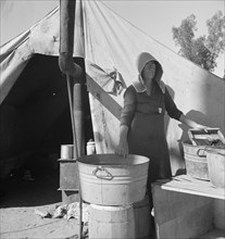 Texas woman in carrot pullers' camp, Imperial Valley, California, 1939. Creator: Dorothea Lange.