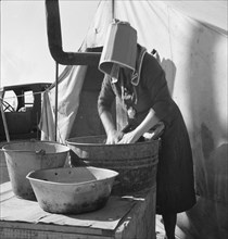 Texas woman in carrot pullers' camp, Imperial Valley, California, 1939. Creator: Dorothea Lange.