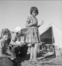 Part of family arrived the night before...near Holtville, Imperial Valley, California, 1939. Creator: Dorothea Lange.