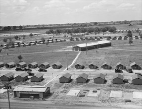View of FSA camp Farmersville seen from water tower, Tulare County, California, 1939. Creator: Dorothea Lange.