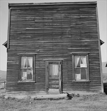 Member of Ola self help sawmill co-op..., "Jacknife Saloon", Gem County, Idaho, 1939. Creator: Dorothea Lange.