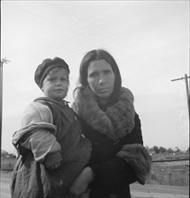 Homeless mother and youngest child of seven...US99, near Brawley, Imperial County, 1939. Creator: Dorothea Lange.
