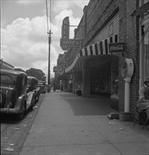 The main street, Fayetteville Street, of Siler City, North Carolina, 1939. Creator: Dorothea Lange.