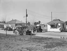 Entering FSA camp for migratory laborers at Indio, Coachella Valley, CA, 1939. Creator: Dorothea Lange.