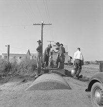 Town pump of Tulelake at railroad yard, Tulelake, Siskiyou County, California, 1939. Creator: Dorothea Lange.
