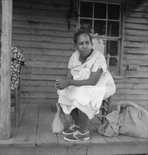 Possibly: Mother of sharecropper family and friend...the rain, Person County, North Carolina, 1939. Creator: Dorothea Lange.