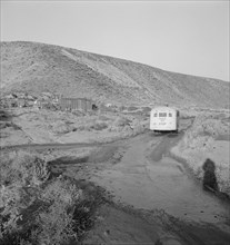School bus starts up the flat 7:30 a.m. to collect children of new..., Malheur County, Oregon, 1939. Creator: Dorothea Lange.