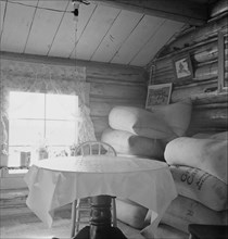 Interior of farmer's two-room log home, FSA borrower, Boundary County, Idaho, 1939. Creator: Dorothea Lange.
