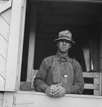 Mr. Granger, seen in doorway of his new barn, Yamhill County, Willamette Valley, Oregon, 1939. Creator: Dorothea Lange.