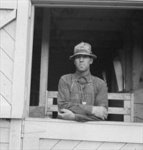 Mr. Granger, seen in doorway of his new barn, Yamhill County, Oregon, 1939. Creator: Dorothea Lange.