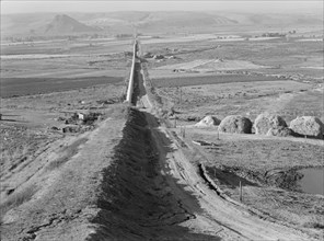 The longest siphon in the world crosses the Malheur Valley, Malheur County, Oregon, 1939. Creator: Dorothea Lange.