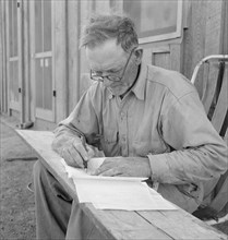 Oklahoma farmer, now living in Cow Hollow, is a FSA borrower, Malheur County, Oregon, 1939. Creator: Dorothea Lange.