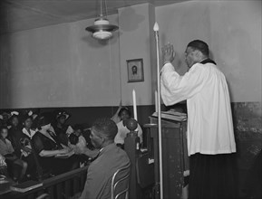 Reverend Vondell Gassaway, pastor of the St. Martin's Spiritual Church..., Washington, D.C., 1942. Creator: Gordon Parks.