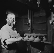 Hot cores to be used by the U.S. Army to make molds for meat..., New Britain, Connecticut, 1943. Creator: Gordon Parks.