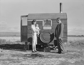 The doctor reassures the mother after having seen the sick..., Merrill, Klamath County, Oregon, 1939 Creator: Dorothea Lange.