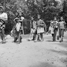 Campers returning from a day's hike at Camp Fern Rock, Bear Mountain, New York, 1943 Creator: Gordon Parks.