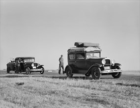 Two families originating from Independence, Kansas, US99, between Tulare and Fresno, 1939. Creator: Dorothea Lange.