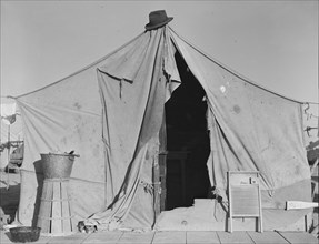 One of a row of tents, home of a pea picker, near Calipatria, Imperial Valley, California, 1939. Creator: Dorothea Lange.