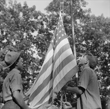 Raising Old Glory at Camp Nathan Hale, Southfields, New York, 1943 Creator: Gordon Parks.