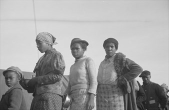 Possibly: Negroes in the lineup for food at meal time in the camp..., Forrest City, Arkansas, 1937. Creator: Walker Evans.