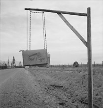 Swinging mail boxes in country where snow is deep in winter, Boundary County, Idaho, 1939. Creator: Dorothea Lange.