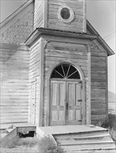 Old Catholic church on edge of potato town, Merrill, Klamath County, Oregon, 1939. Creator: Dorothea Lange.